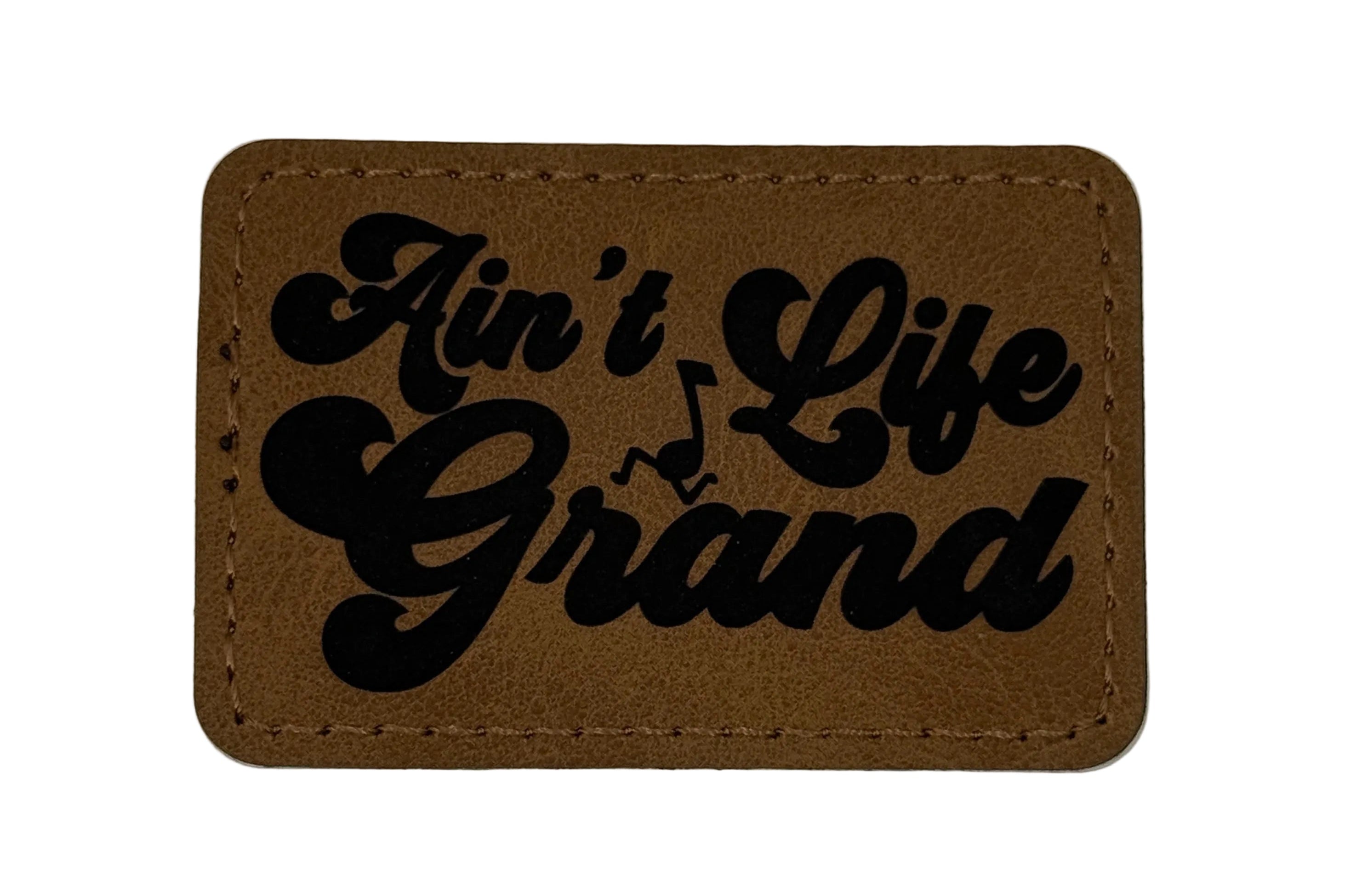 Ain't Life Grand Patch 3x2 | Laser Engraved | Rawhide/Black | Iron or stitch | Panic Fan Art
