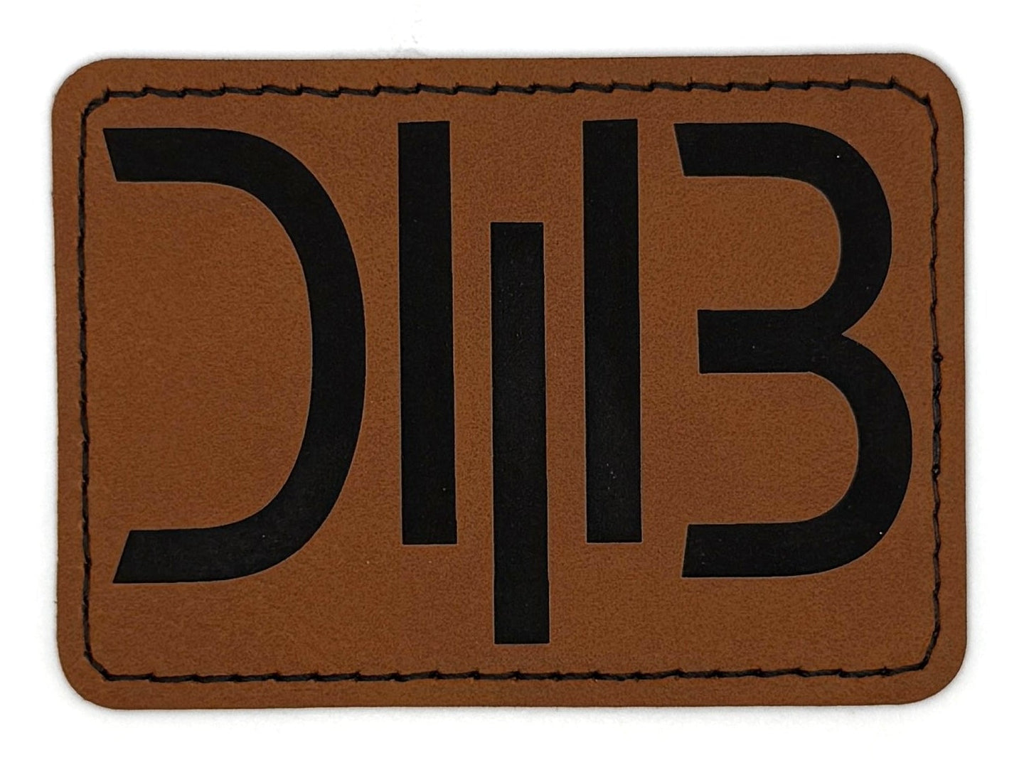 Cryptic D M B Patch 3.5” x 2.5” | Laser Engraved | Rawhide/Black | Iron or stitch | Dave Band Fan Art